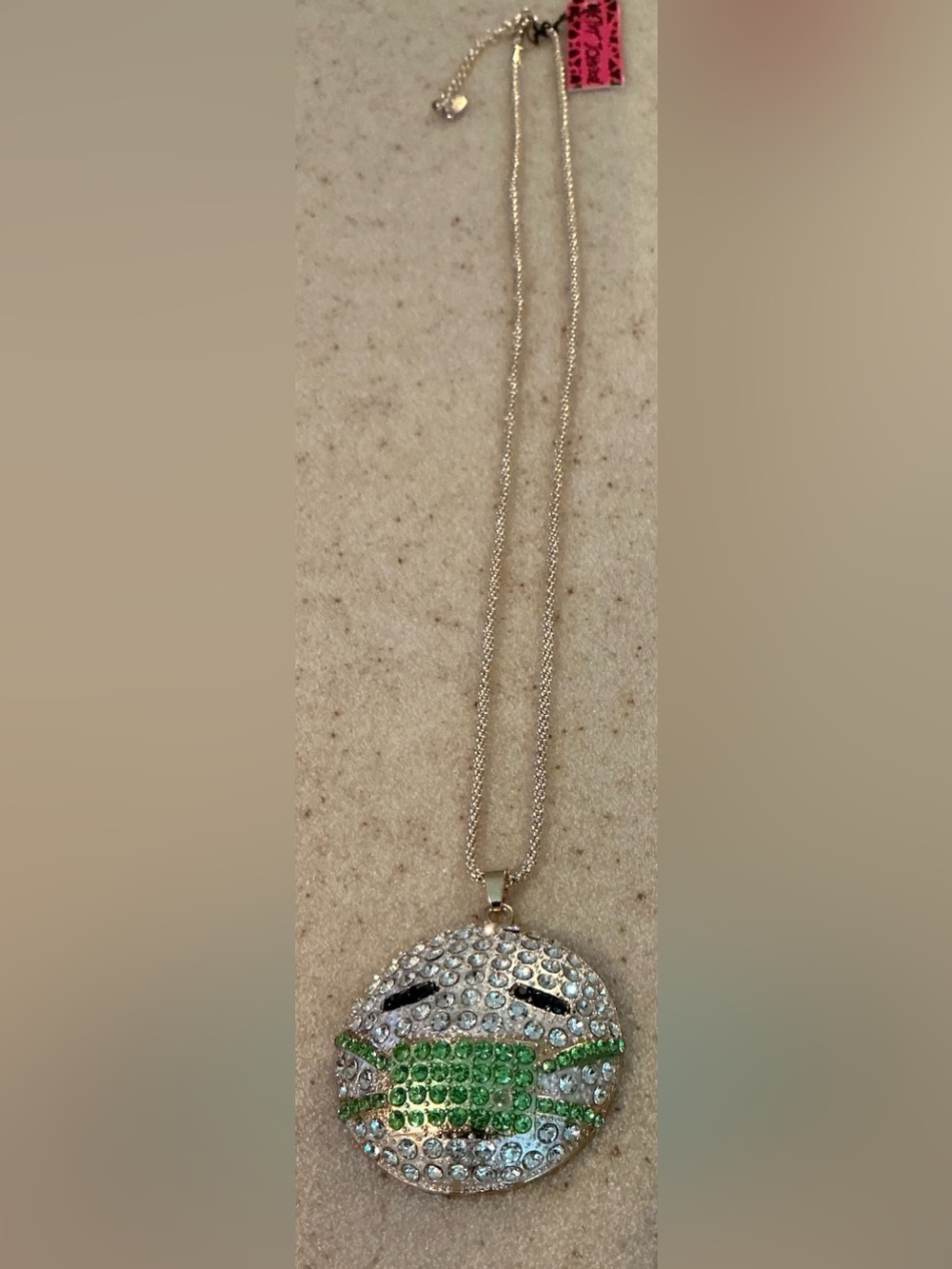 Betsey Johnson Silver Crystal Emoji Mask Pendant Necklace with Green Accents